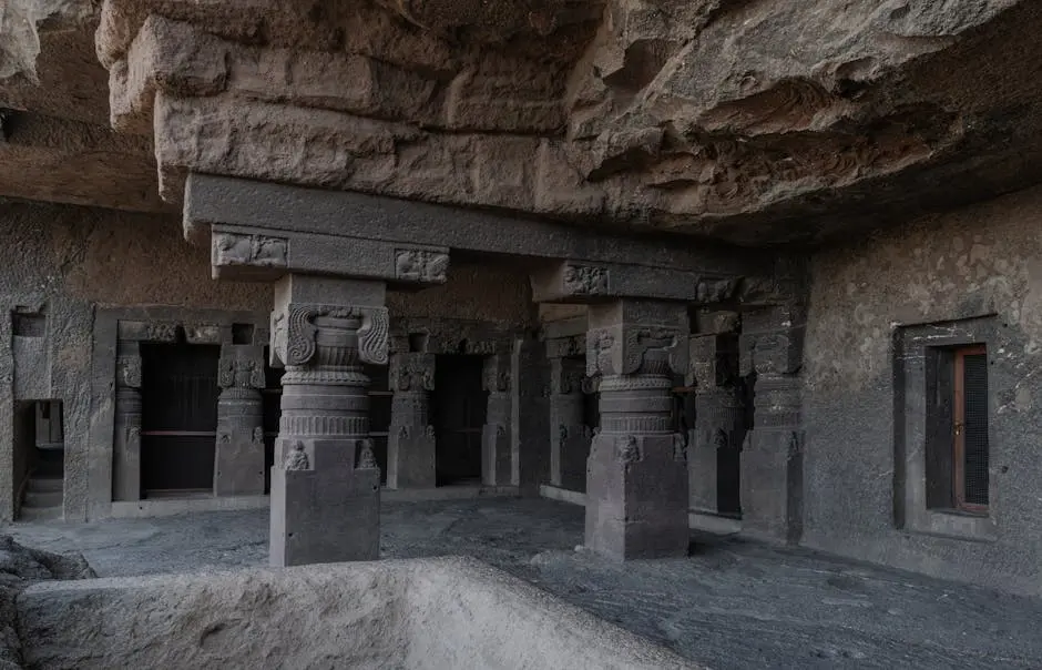 Explore the intricate stone carvings and pillars of the ancient Ellora Caves, Maharashtra, India.