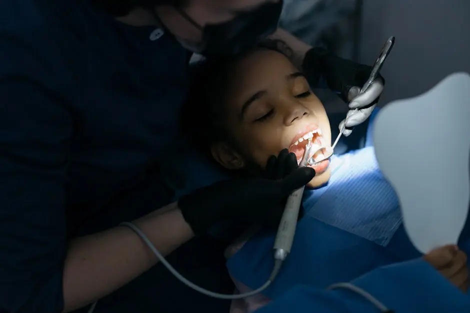 A young girl receiving a dental checkup at a clinic, highlighting oral care.