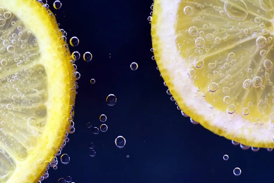 Close-up of lemon slices with bubbles, capturing freshness and vibrancy.