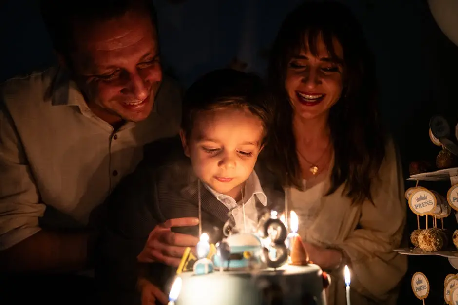 A joyful family moment with a child blowing out birthday candles on a cake.