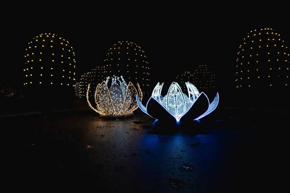 Captivating lotus-shaped lights illuminated in a dark outdoor setting, creating a magical nighttime scene.