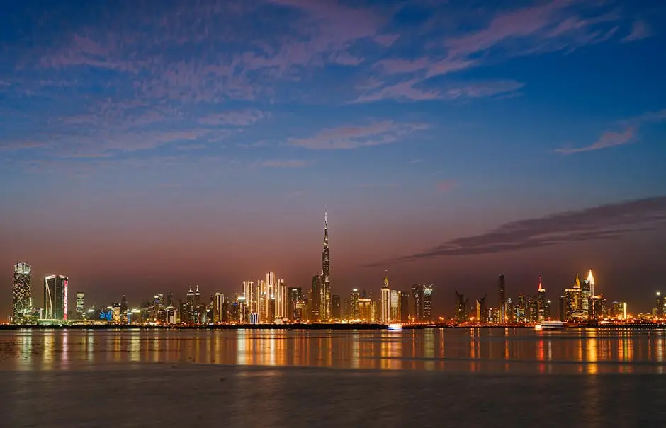 Scenic view of Dubai&rsquo;s skyline at twilight with the iconic Burj Khalifa illuminated across the waterfront.