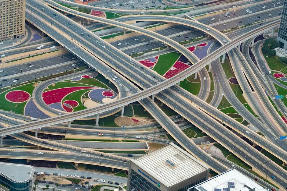 Aerial view of a complex highway interchange in Dubai, showcasing modern urban infrastructure.