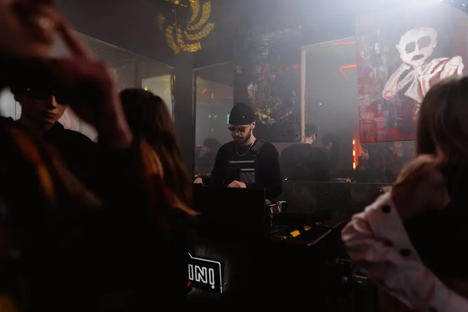 Vibrant nightclub atmosphere with a DJ mixing music, surrounded by partygoers.