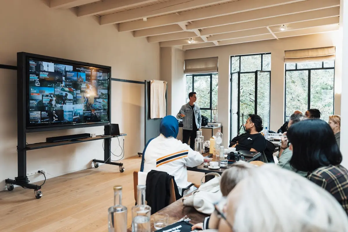 Corporate team engaged in a presentation in a modern office setting.
