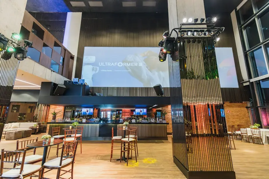 Spacious and modern event hall with projection screen setup, perfect for celebrations and conferences.