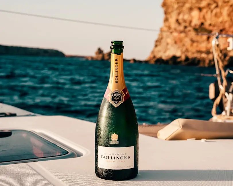 Bollinger champagne bottle on a yacht with Ibiza’s ocean view, perfect for celebrations.