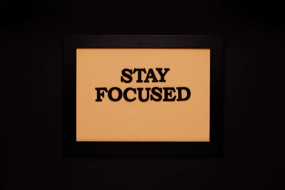 Minimalist black frame with ‘Stay Focused’ text on beige background.