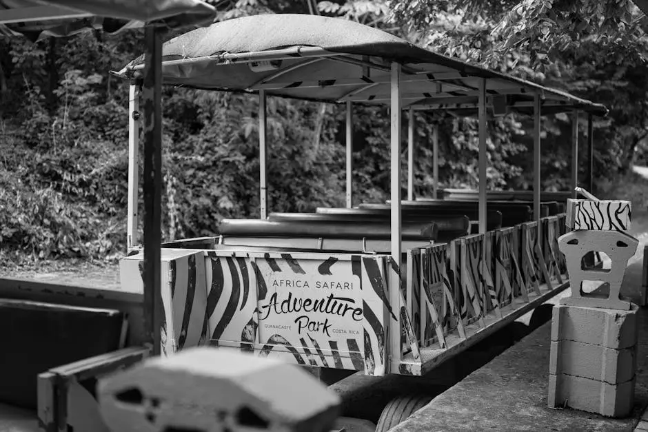 Black and white photo of a safari-themed train in Costa Rica’s Adventure Park.