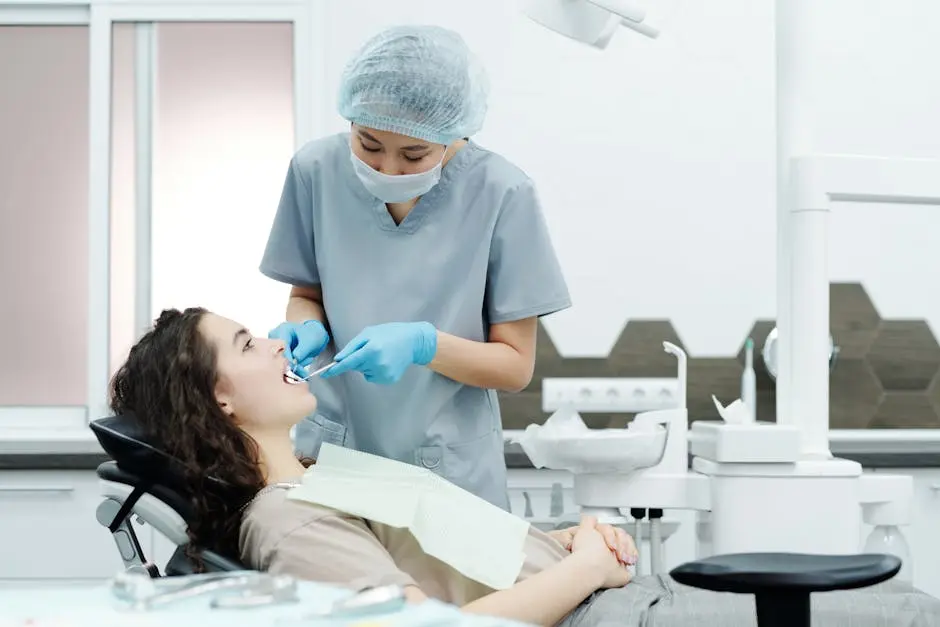 A dentist examines a female patient in a modern dental clinic, ensuring proper dental care.