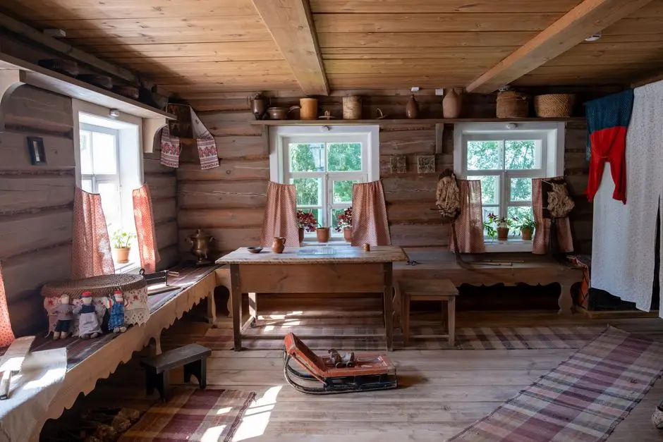 Cozy rustic interior with wooden furniture and traditional decor, creating a warm atmosphere.