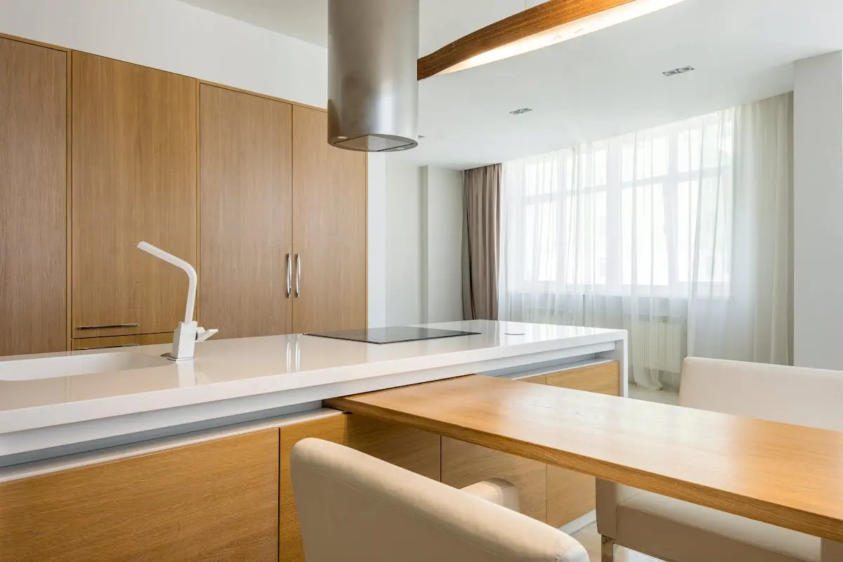 Spacious modern kitchen with wooden accents and natural light. Perfect for lifestyle inspiration.