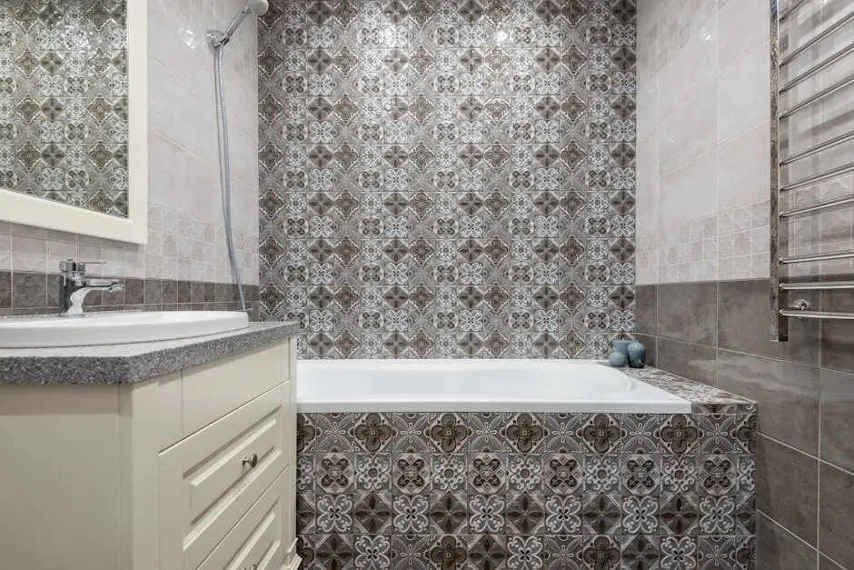 Luxurious bathroom featuring ornate patterned tiles, a sleek bathtub, and modern fixtures.