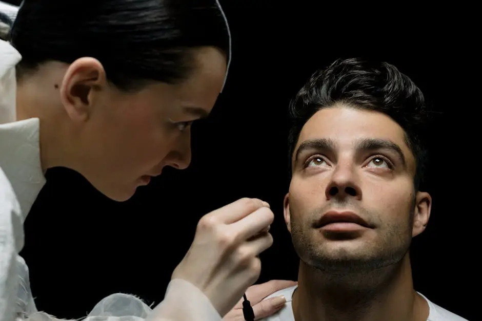 Close-up of a medical professional conducting an eye check on a patient indoors.