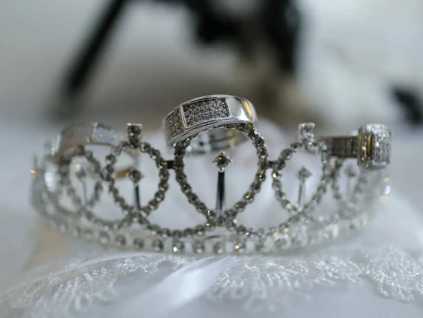 Close-up of a diamond-studded wedding crown adorned with elegant rings.