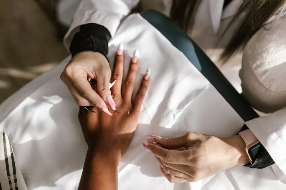 Close-up of hands during an acupuncture therapy session for holistic health and wellness.