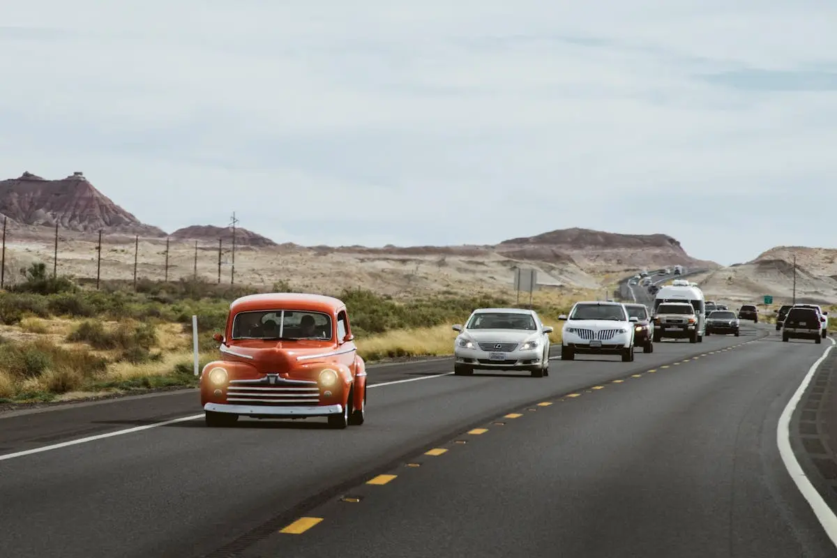 Cars traveling on a desert highway near Young, AZ, with scenic desert views.