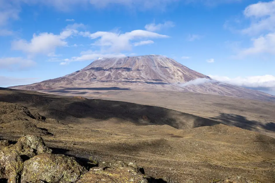 Breathtaking view of Mount Kilimanjaro under a clear blue sky, perfect for travel and adventure enthusiasts.