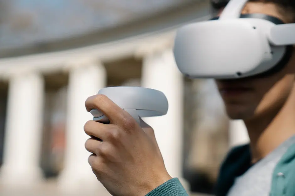 Crop young male in modern goggles of virtual reality using controllers while standing near building on street on daytime