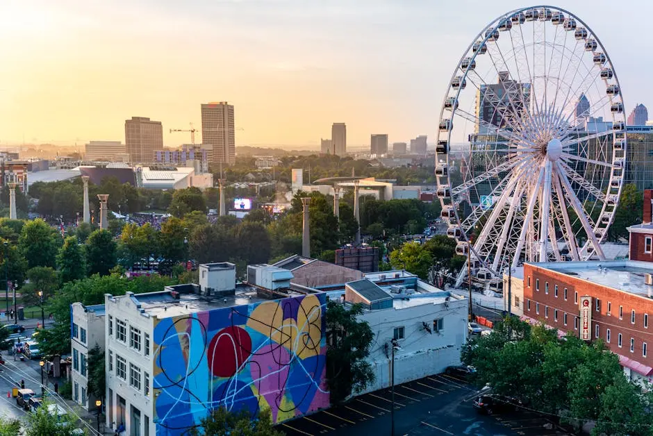 Aerial view of Atlanta skyline with SkyView Ferris Wheel at sunset.