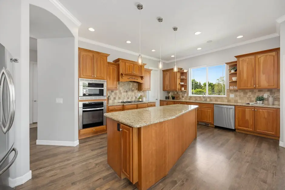 A bright and spacious kitchen featuring wood cabinets, an island, and modern appliances for a warm and inviting space.