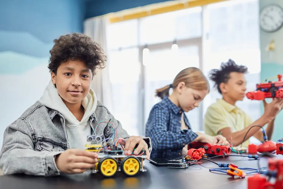 Children learning robotics teamwork with electronic toy projects indoors.