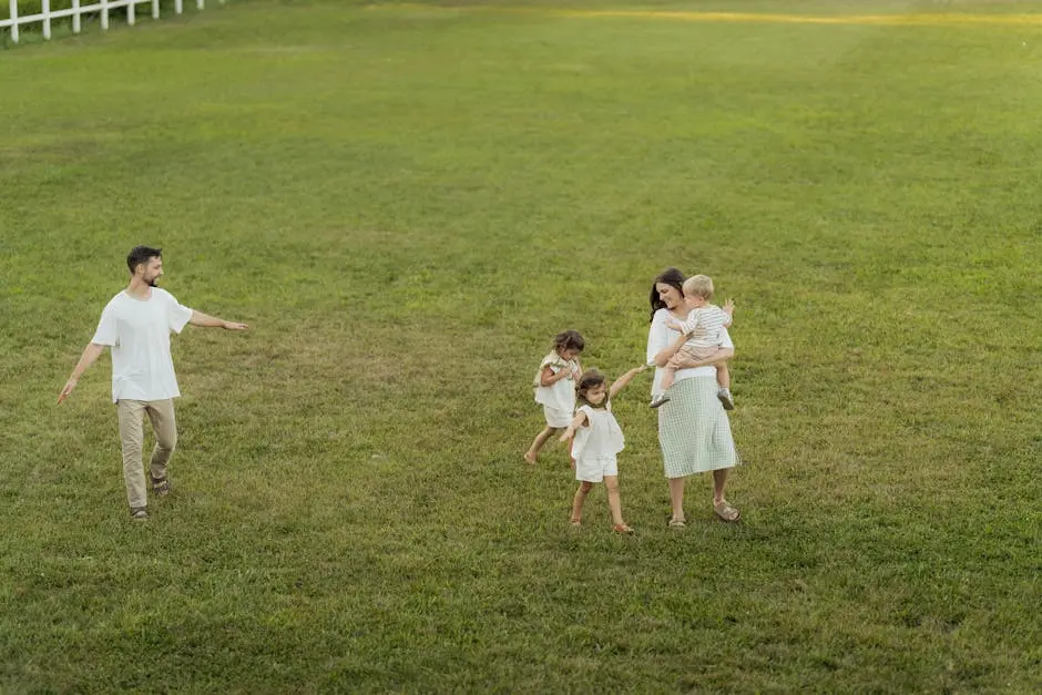A joyful family enjoying a sunny day outdoors in a green park.