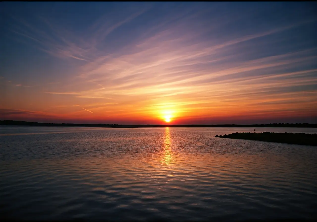 A peaceful sunset over a tranquil, serene landscape. 35mm stock photo