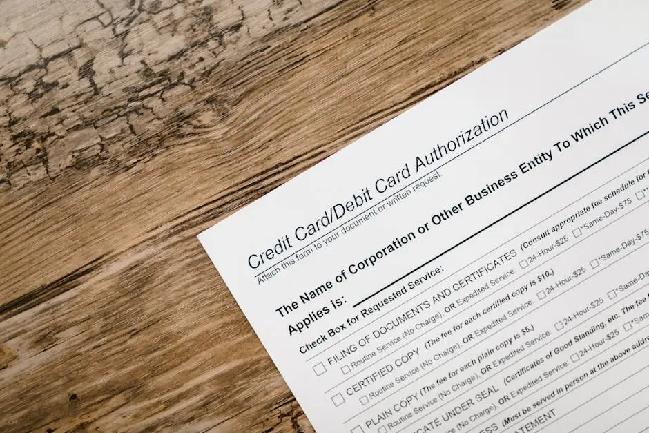 A credit card authorization form placed on a wooden desk, highlighting business paperwork essentials.