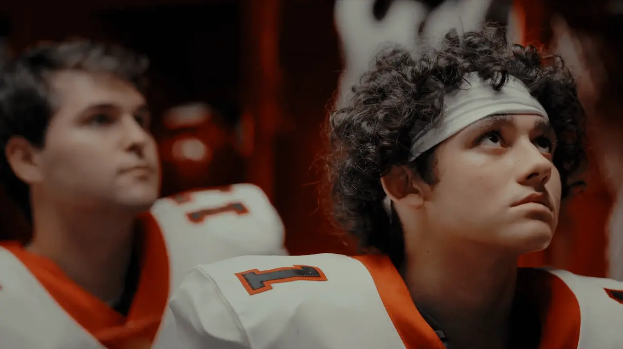 Football players reacting to the coach.