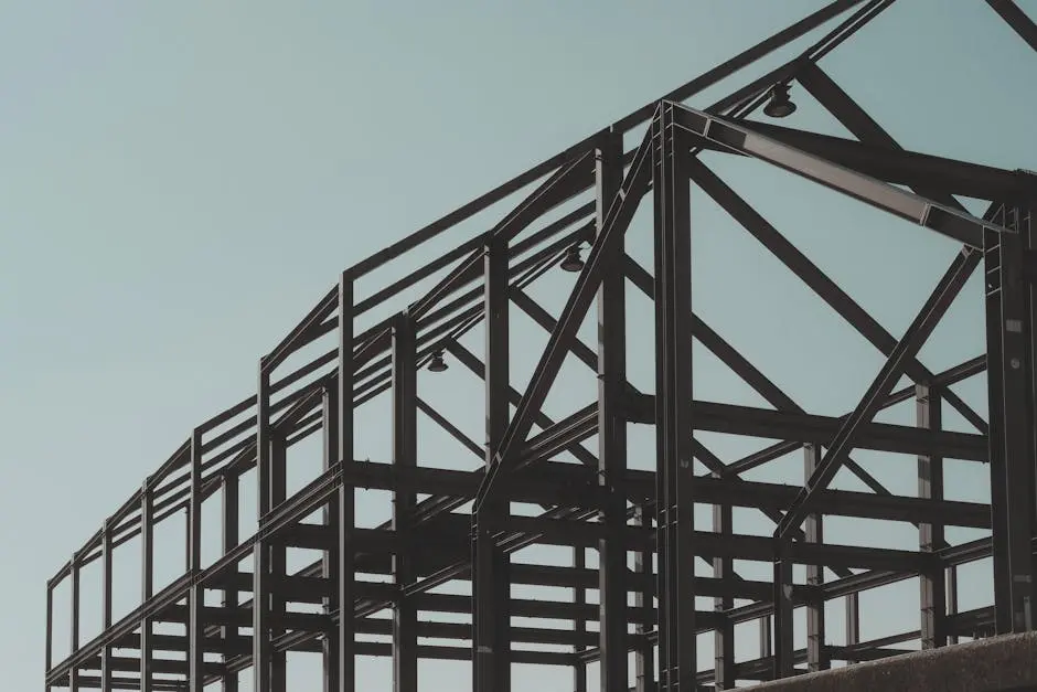Modern steel framework structure under clear sky, showcasing architectural design.