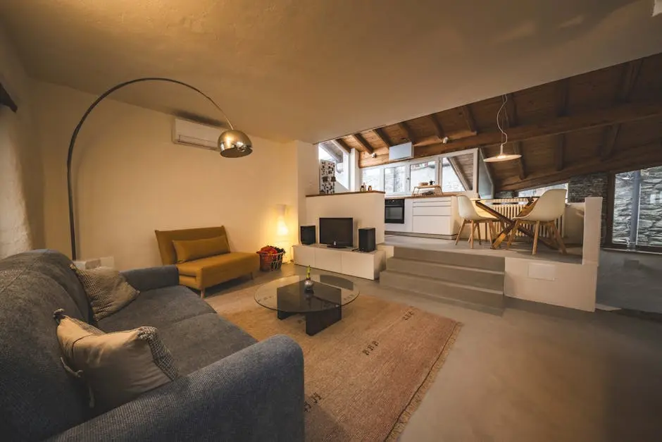 Cozy modern living room with kitchen and dining area in Calozzo, Italy.