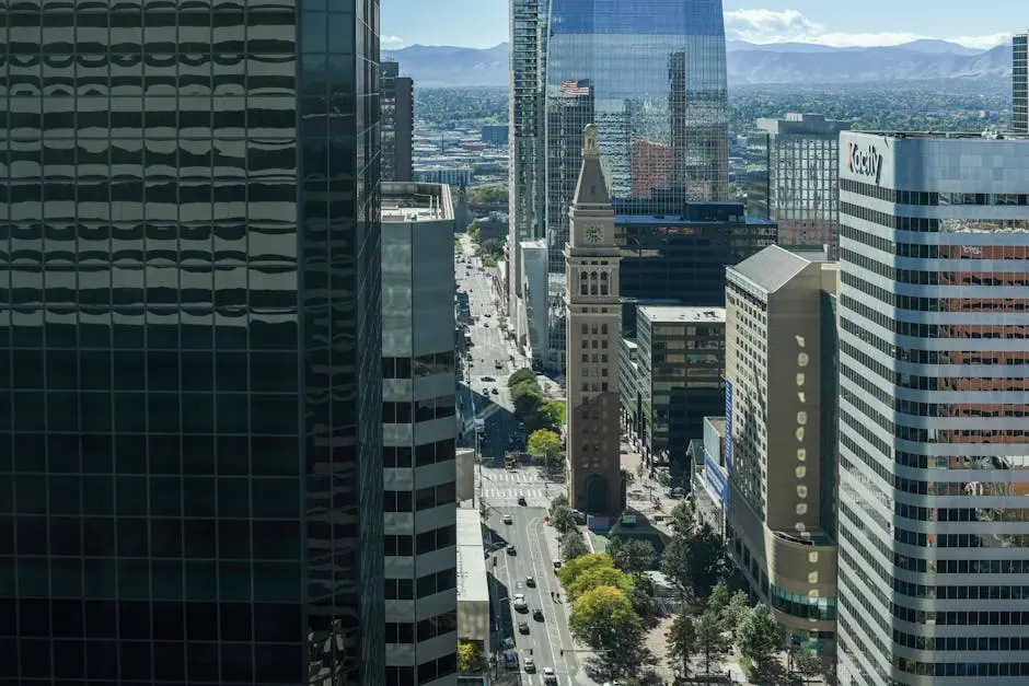 A stunning aerial view of downtown Denver showcasing the iconic clock tower amidst modern skyscrapers.