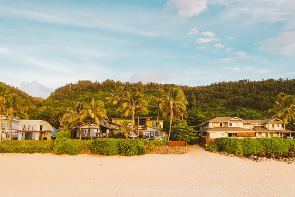 Beautiful beachfront villas with palm trees on a sandy coastline. Ideal tropical getaway.