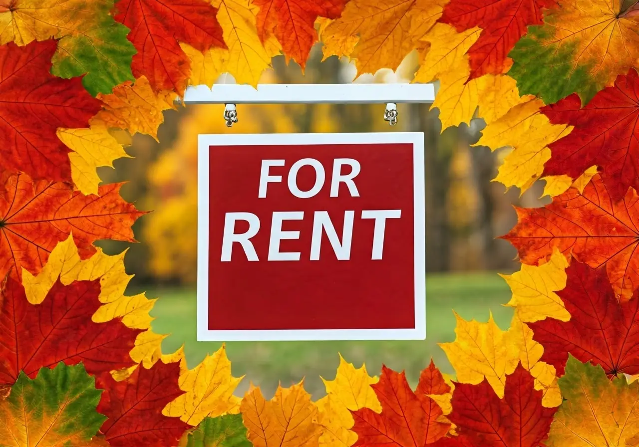 Colorful autumn leaves framing a For Rent sign. 35mm stock photo
