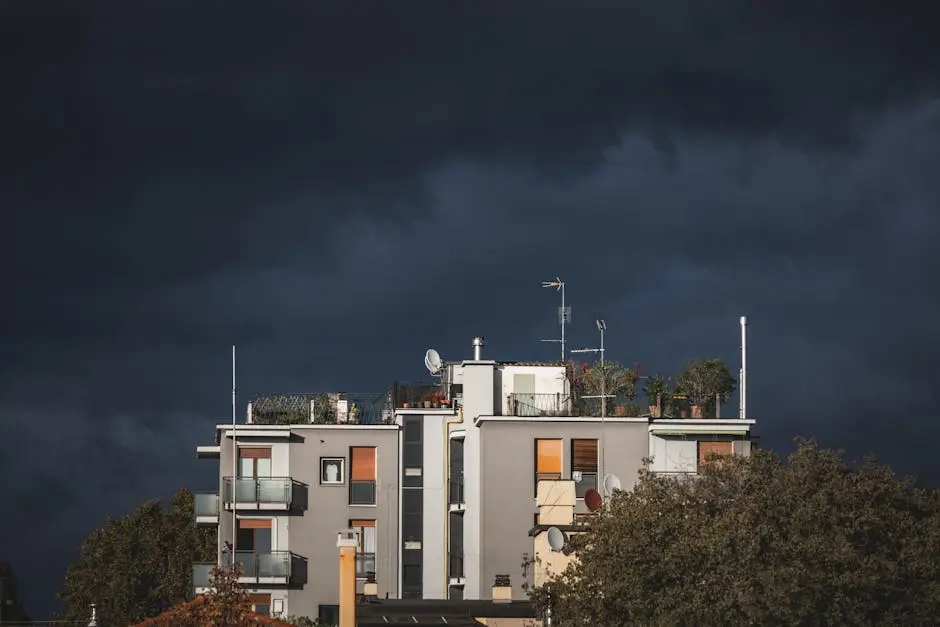 Urban residential building stands out against a dramatic stormy sky, creating a striking contrast.