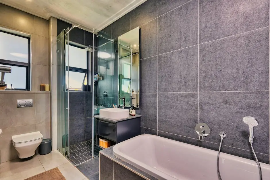A sleek and stylish bathroom design featuring a bathtub and glass shower in Pretoria, South Africa.