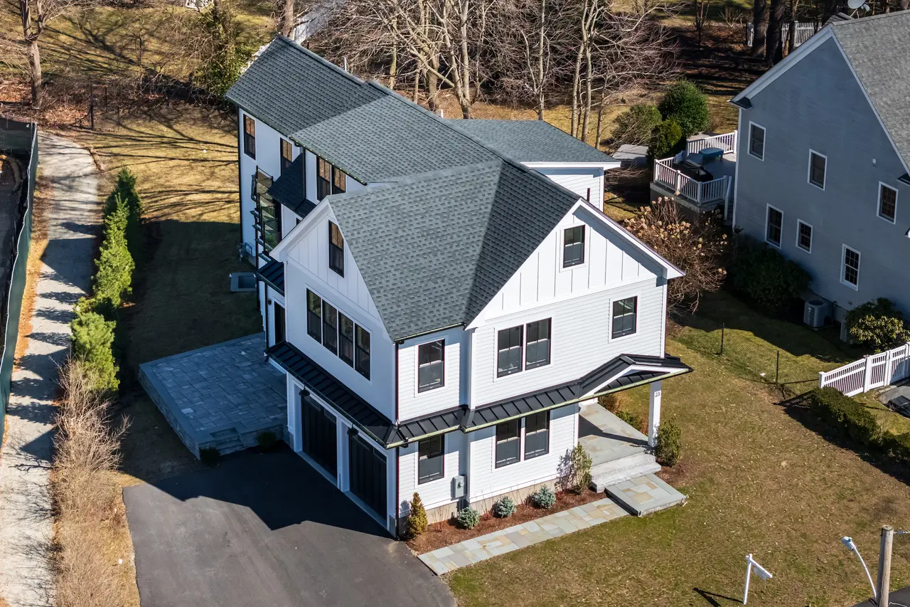 white colored house with blue roof