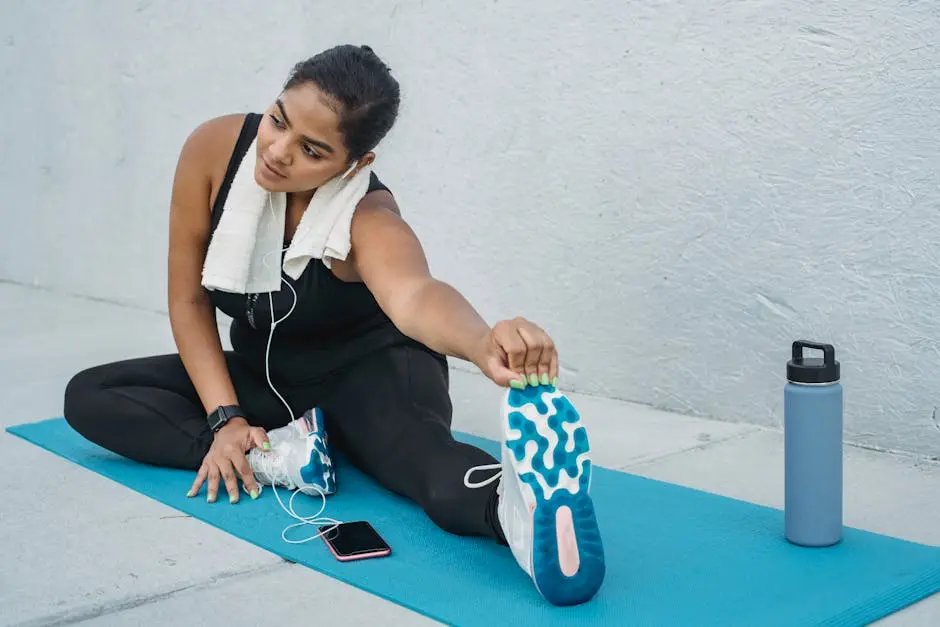 Woman stretching on yoga mat outdoors, showcasing a healthy lifestyle.
