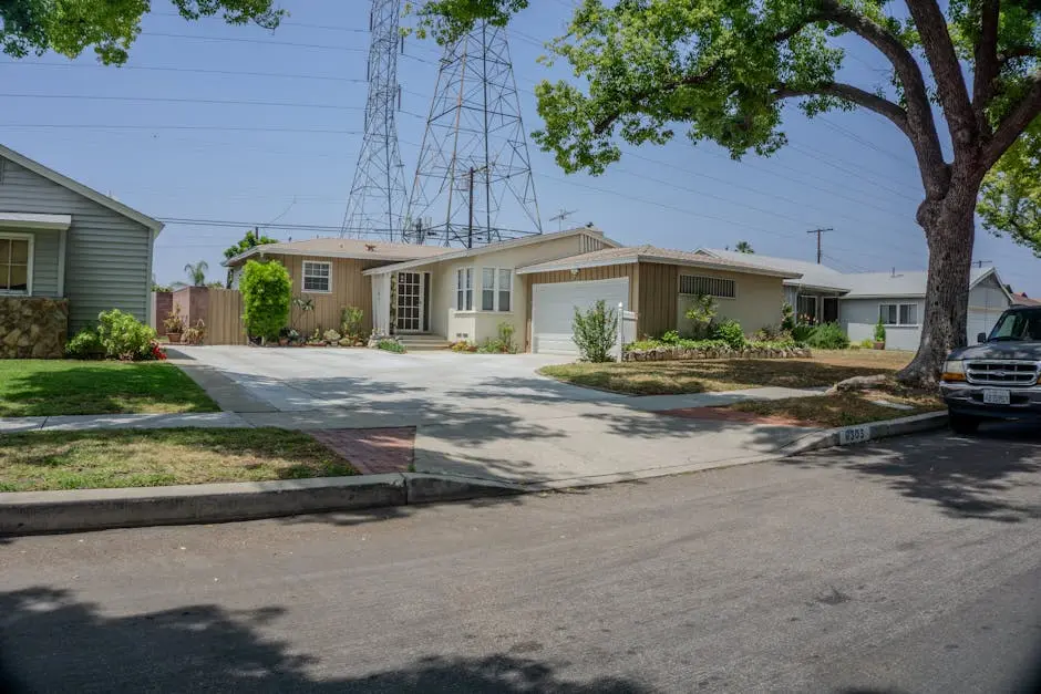 Charming suburban street with mid-century homes and lush greenery on a sunny day.