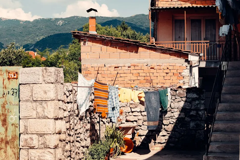 Charming rustic backyard with clothesline against a scenic mountain backdrop in Kuzey Makedonya.