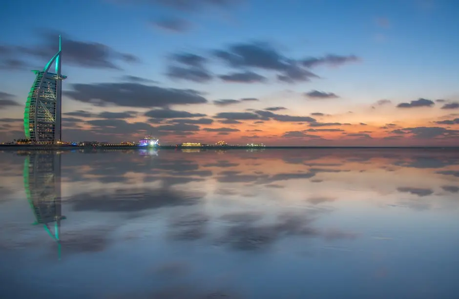 Scenic view of Burj Al Arab with stunning dusk reflections in Dubai&rsquo;s calm sea.