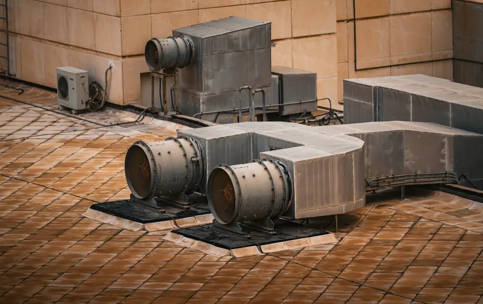 An industrial HVAC system installed on a modern building rooftop in Kuwait City.