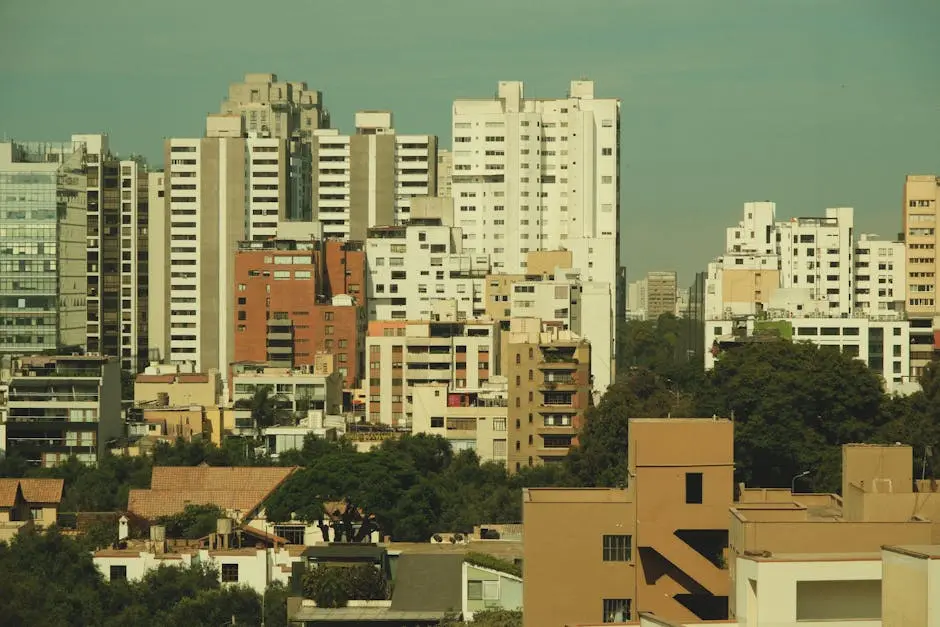 Cityscape featuring a skyline of tall, modern buildings against a clear sky.