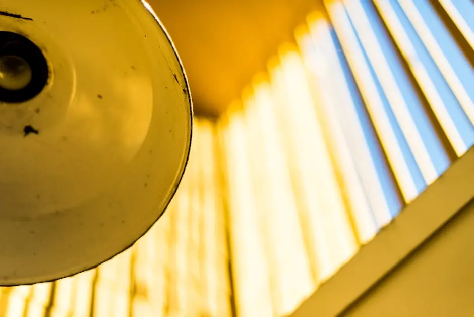 Artistic close-up of a yellow lamp and window shadows creating abstract patterns.
