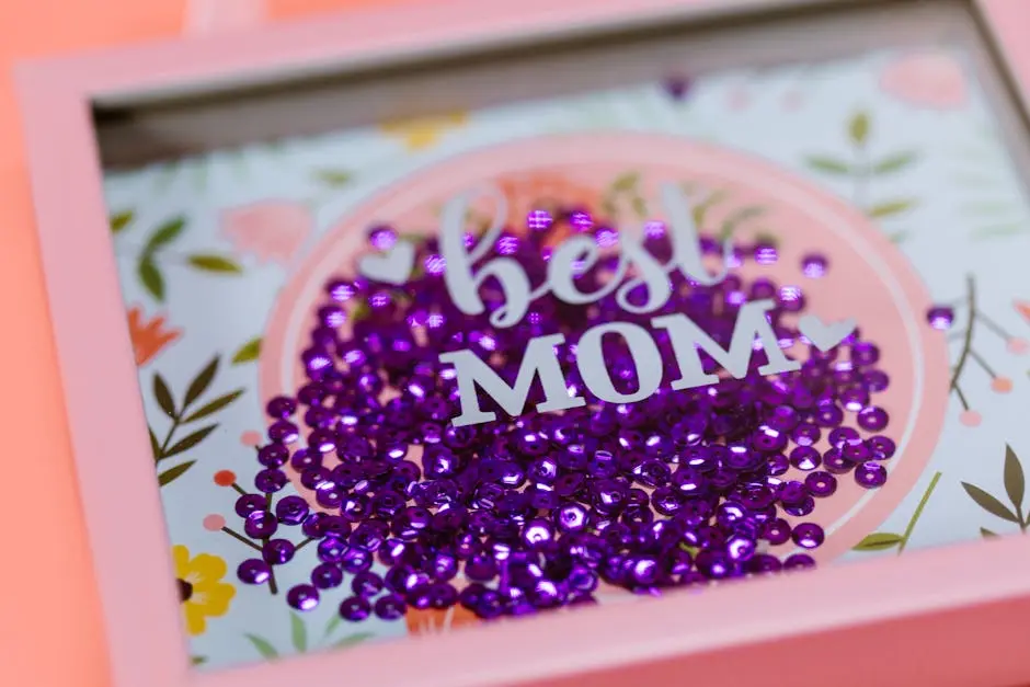 Vibrant ‘Best Mom’ shadow box with purple sequins, ideal gift for Mother’s Day.