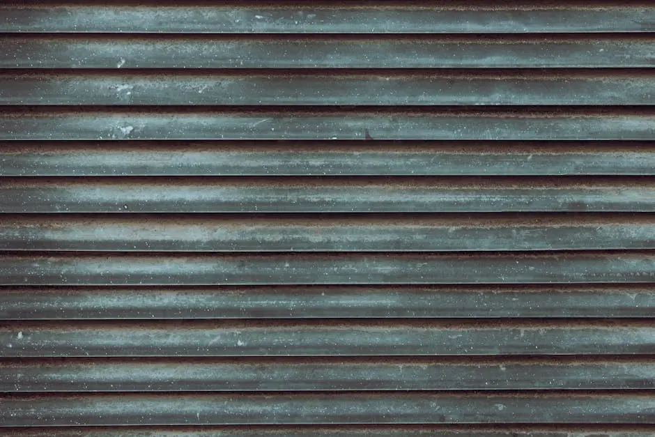 Close-up view of a rustic metal roll-up door with weathered textures.