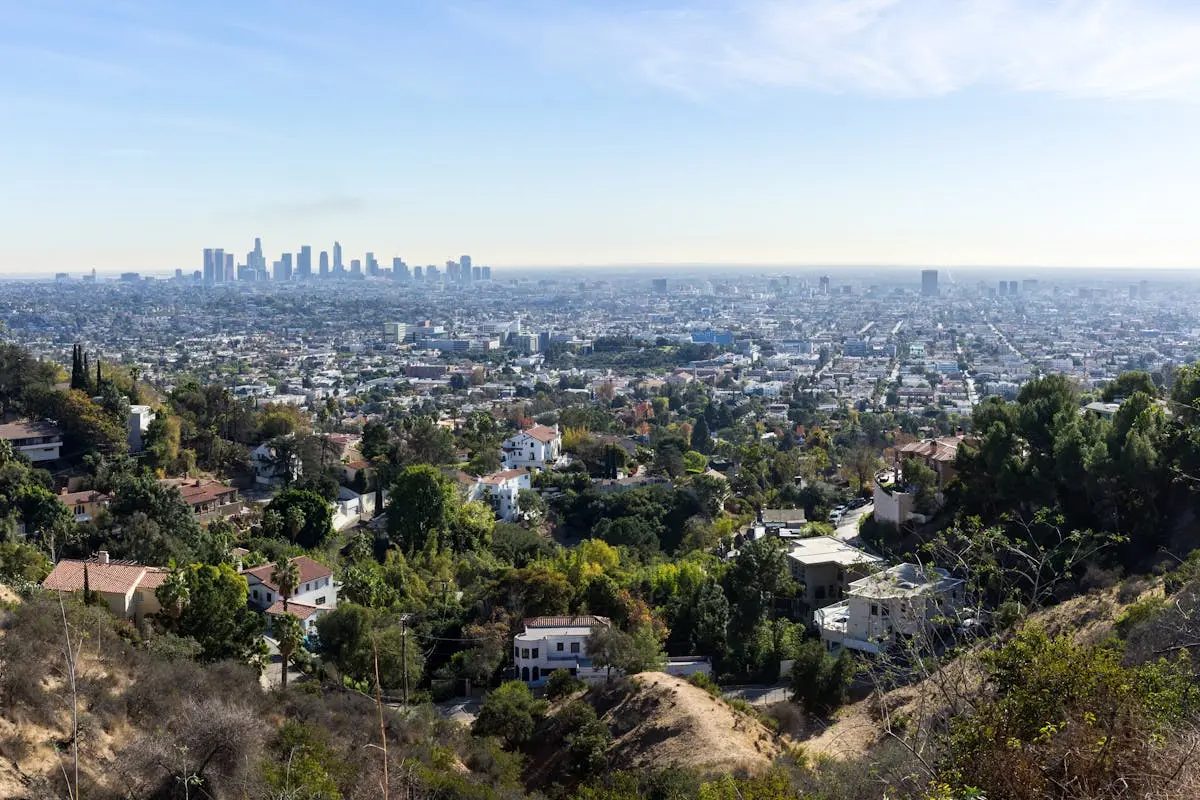 Scenic aerial view of Los Angeles skyline from the hills during the day.
