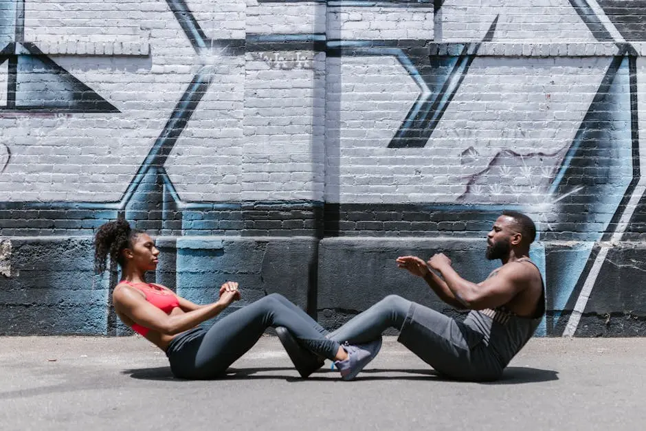 A couple engages in a fitness workout against a graffiti-covered brick wall, promoting a healthy lifestyle.