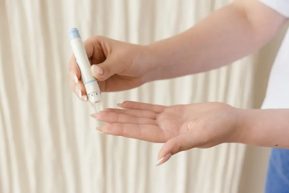 Close-up of hands using a glucometer for diabetes monitoring.